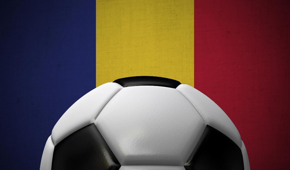 Foot ball in front of romanian flag